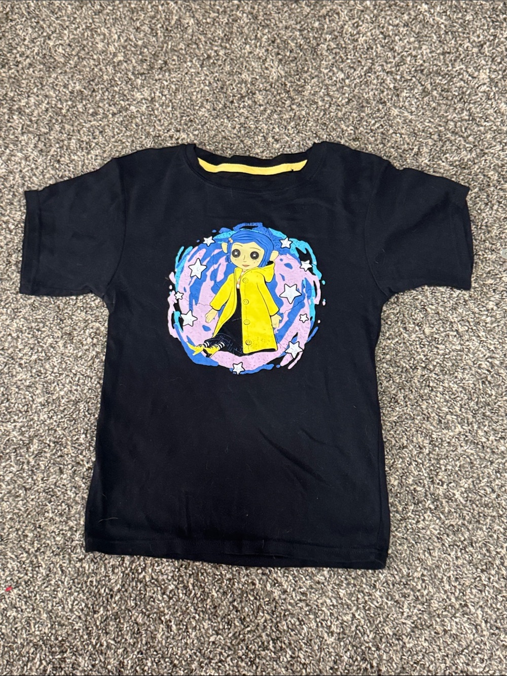 Black Short-Sleeve Graphic Tee with Yellow Character Accent